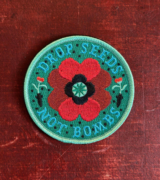 Haags Zaad geborduurde patch 'DROP SEEDS - NOT BOMBS' 2.0