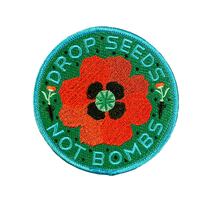 Haags Zaad geborduurde patch 'DROP SEEDS - NOT BOMBS'
